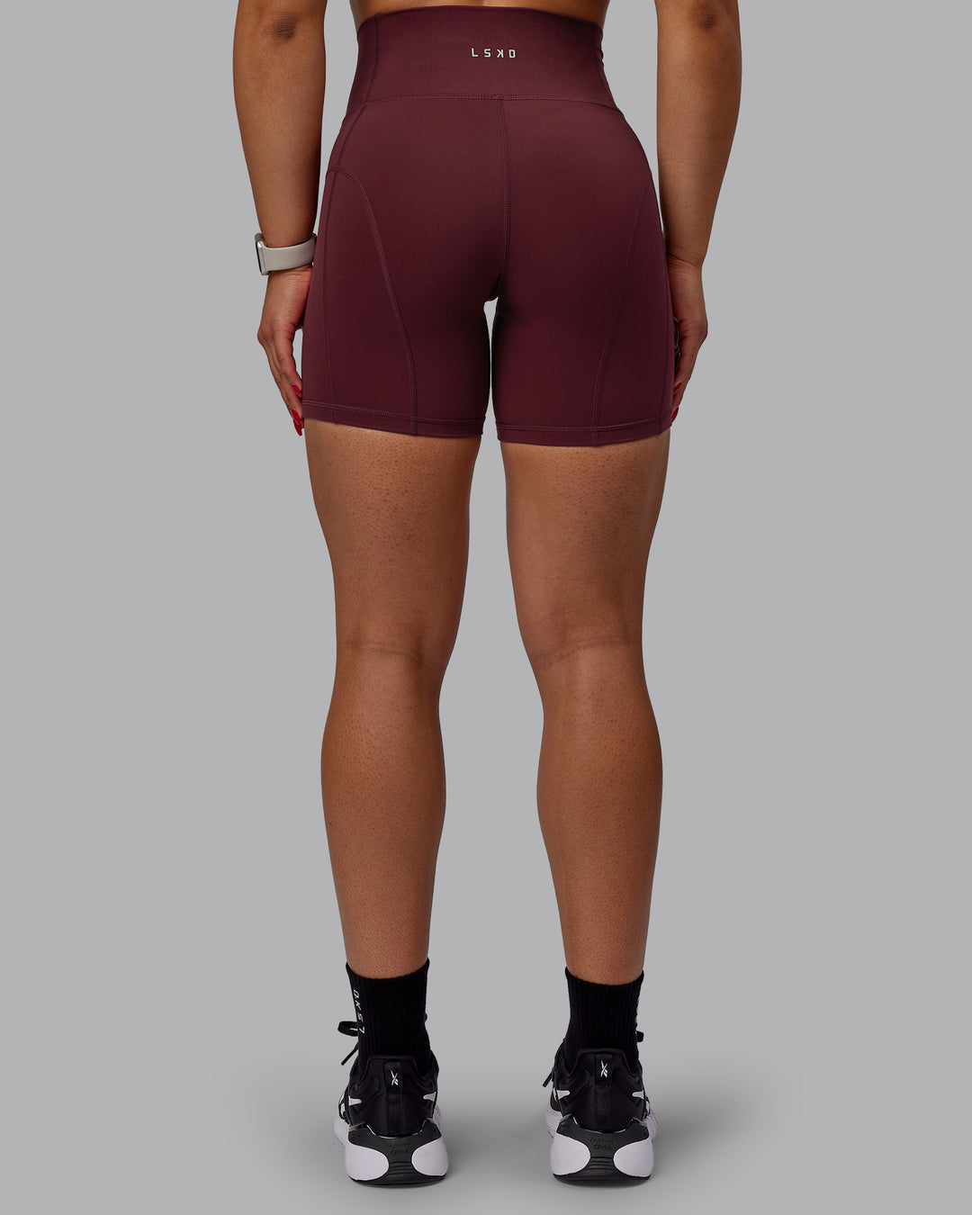 Woman wearing Bend Ultra High-Rise 6" Short - Dark Cherry