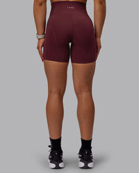 Woman wearing Bend Ultra High-Rise 6" Short - Dark Cherry