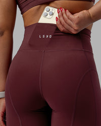 Woman wearing Bend Ultra High-Rise 6" Short - Dark Cherry
