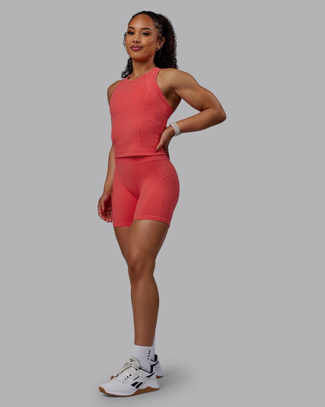 Woman wearing Bend Performance Tank - Cayenne