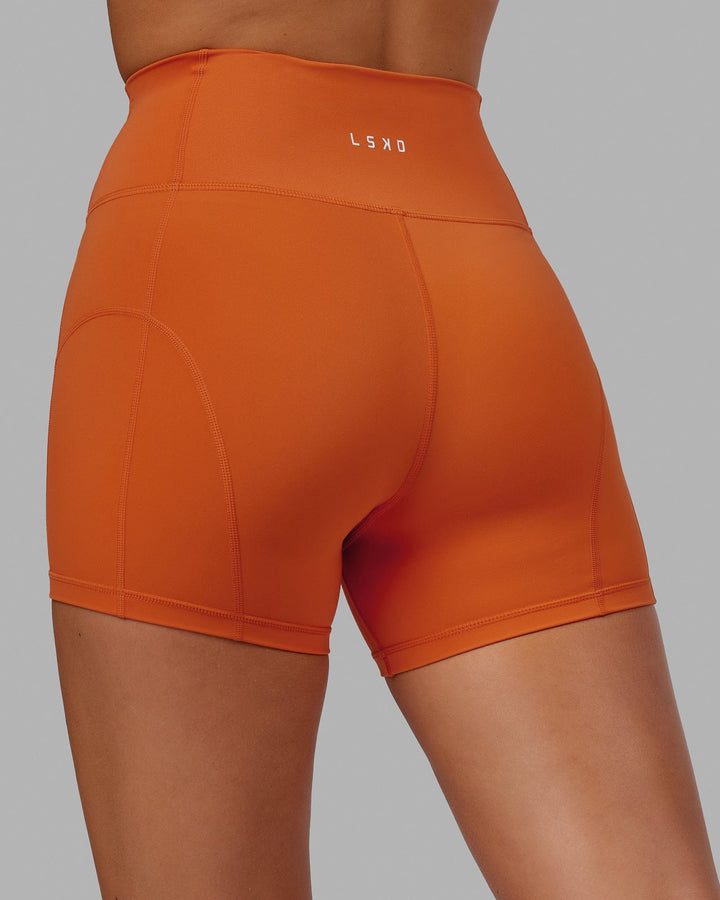 Woman wearing Bend X-Short Tight - Burnt Orange