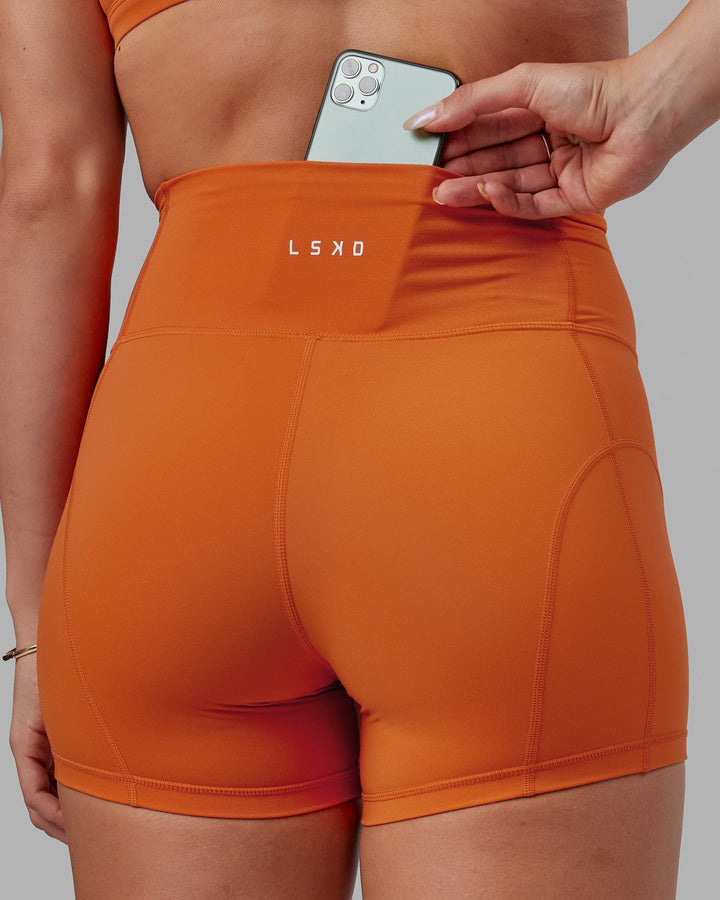 Woman wearing Bend X-Short Tight - Burnt Orange