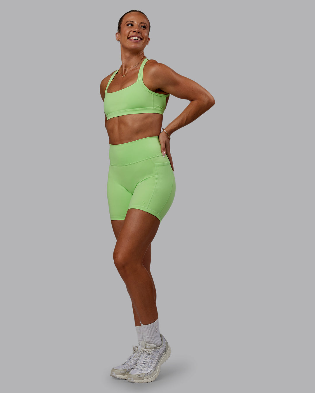 Woman wearing Bree Masters Fusion Ultra High-Rise 6&quot; Short Pockets - Pastel Lime