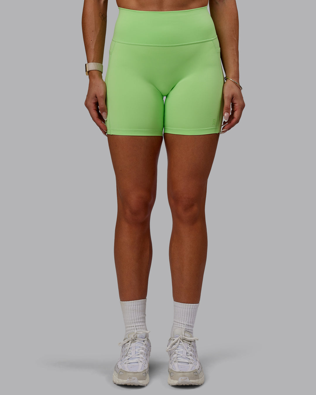 Woman wearing Bree Masters Fusion Ultra High-Rise 6&quot; Short Pockets - Pastel Lime