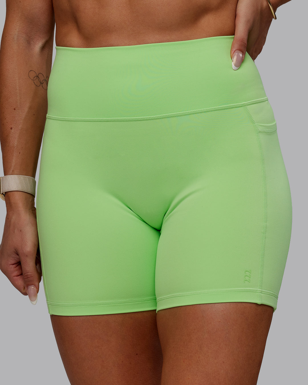 Woman wearing Bree Masters Fusion Ultra High-Rise 6&quot; Short Pockets - Pastel Lime