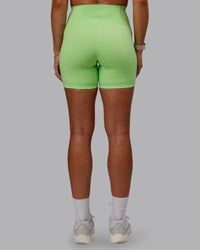 Woman wearing Bree Masters Fusion Ultra High-Rise 6" Short Pockets - Pastel Lime