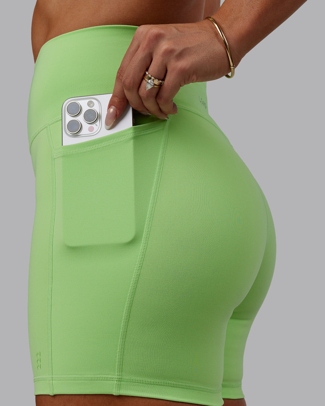 Woman wearing Bree Masters Fusion Ultra High-Rise 6&quot; Short Pockets - Pastel Lime