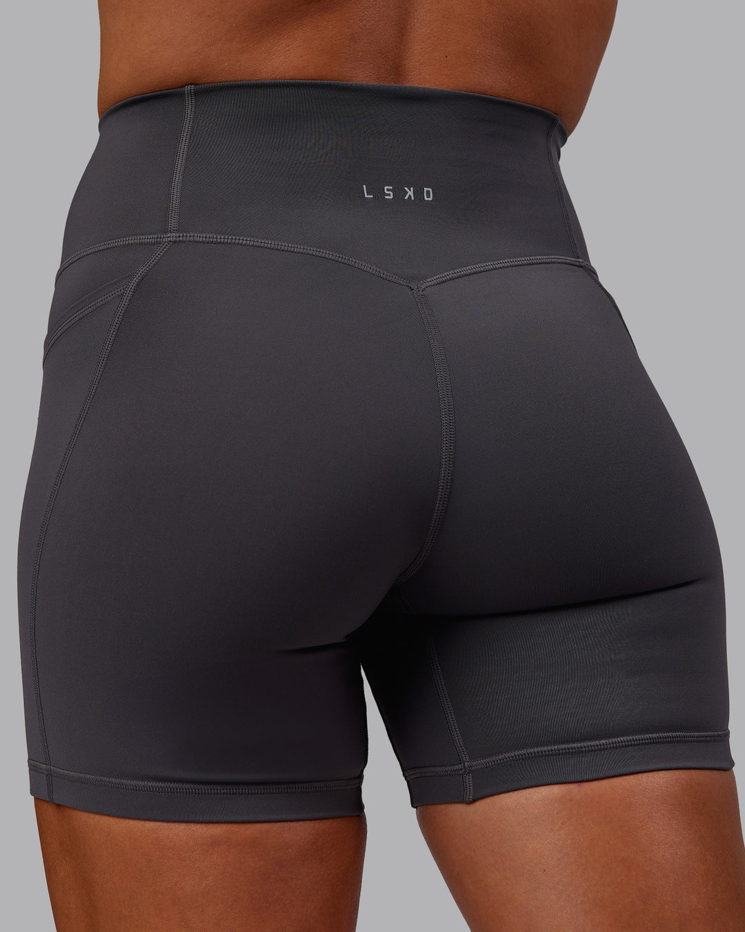 Woman wearing Bree Masters Fusion Ultra High-Rise 6" Short Pockets - Stormy