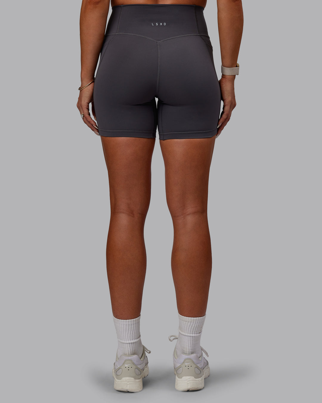 Woman wearing Bree Masters Fusion Ultra High-Rise 6" Short Pockets - Stormy