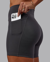 Woman wearing Bree Masters Fusion Ultra High-Rise 6" Short Pockets - Stormy