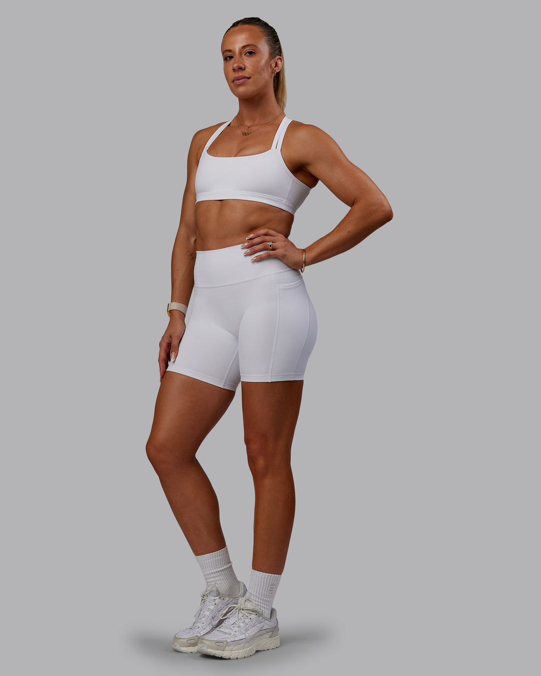 Woman wearing Bree Masters Fusion Ultra High-Rise 6&quot; Short Pockets - White