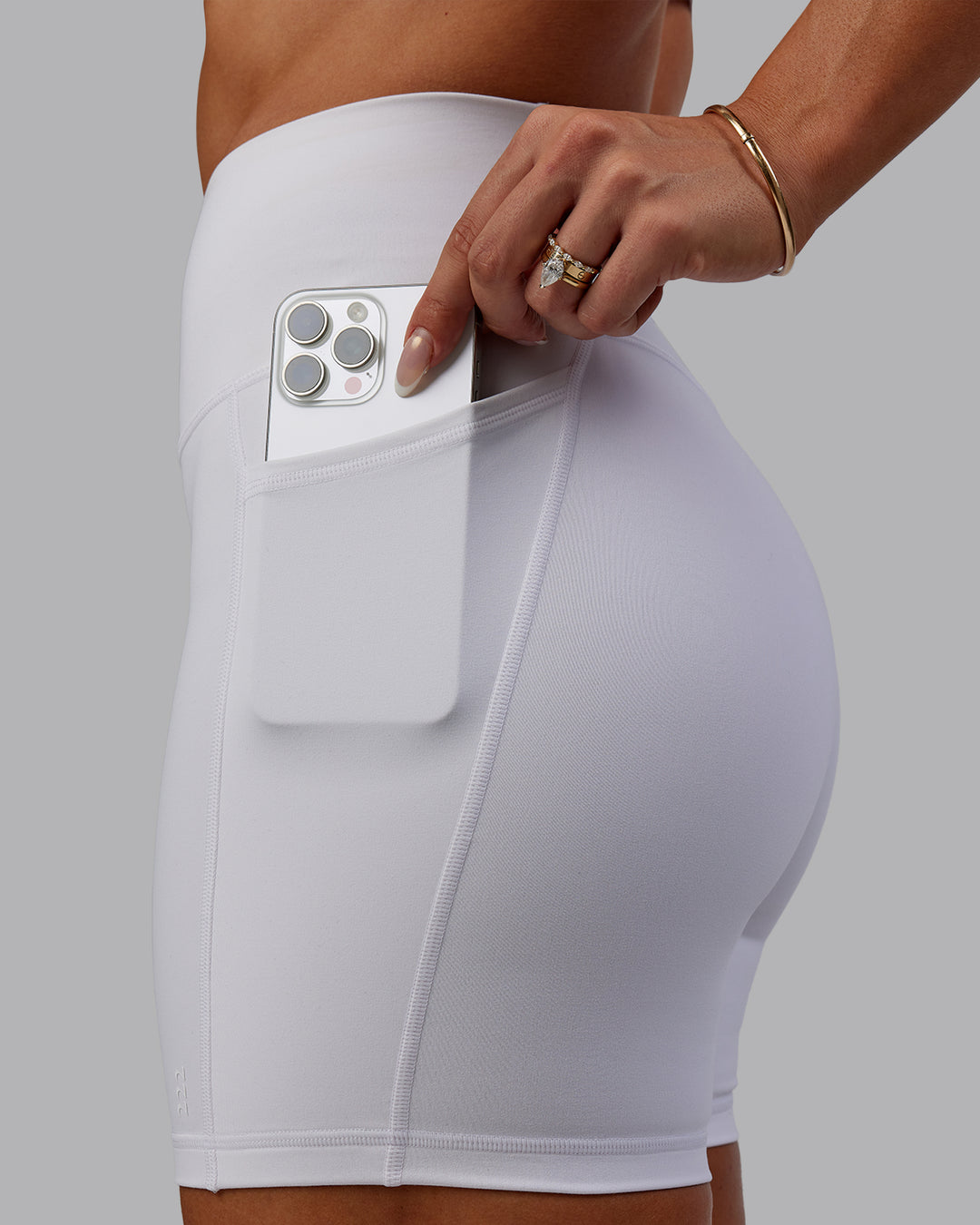 Woman wearing Bree Masters Fusion Ultra High-Rise 6&quot; Short Pockets - White