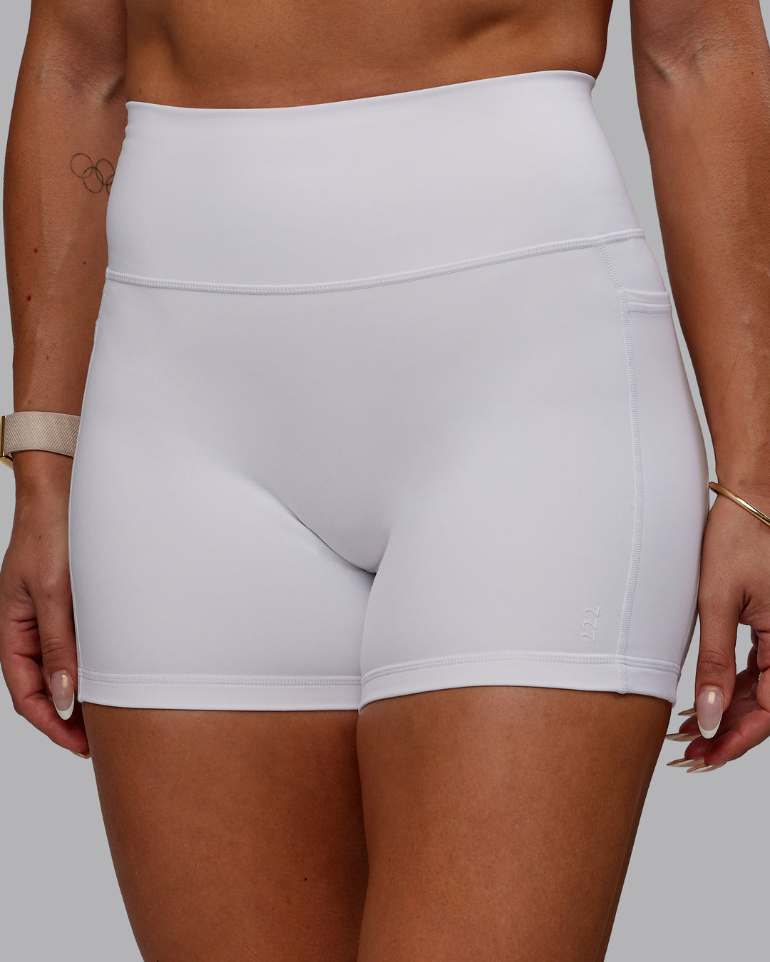 Woman wearing Bree Masters Fusion Ultra High-Rise 4" Short Pockets - White