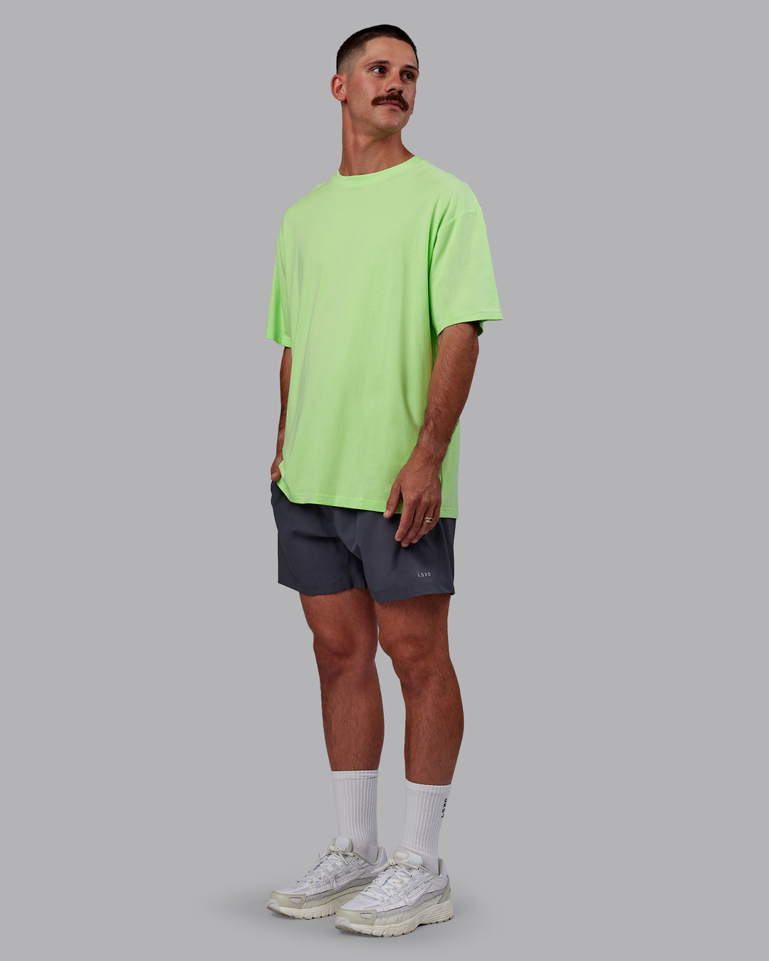Man wearing Bree Masters Unisex Vision FLXCotton Tee Oversize - Pastel Lime-Stormy