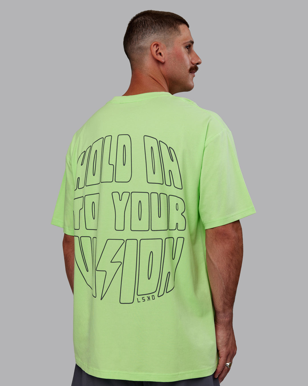Man wearing Bree Masters Unisex Vision FLXCotton Tee Oversize - Pastel Lime-Stormy