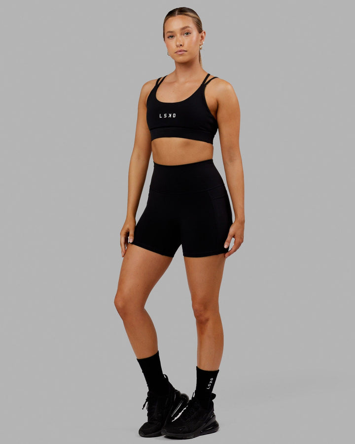 Woman wearing Bridge Sports Bra - Black-White