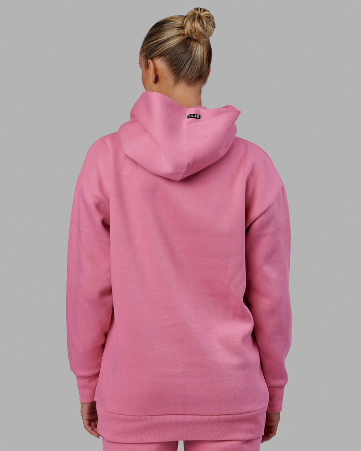 Woman wearing Unisex Capsule Hoodie Oversize - Pink Rose