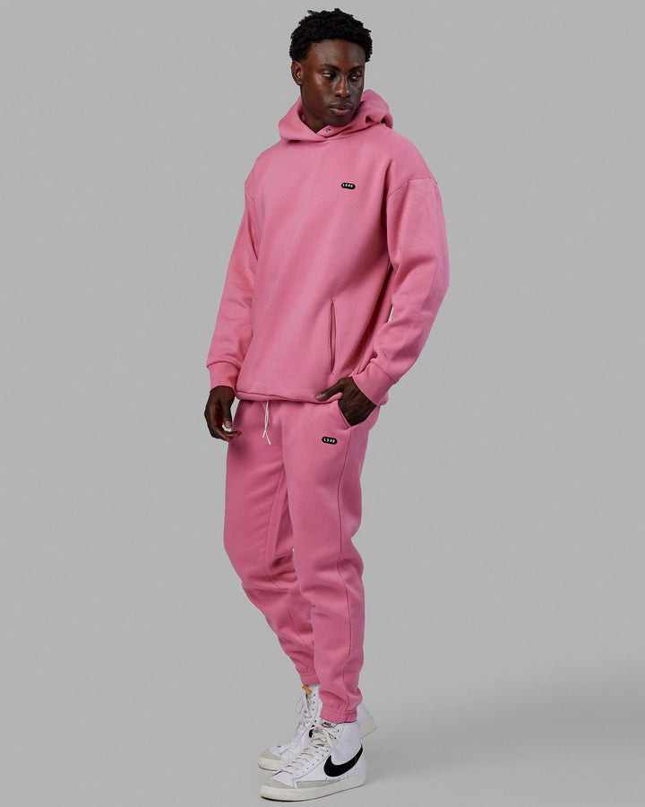 Man wearing Unisex Capsule Hoodie Oversize - Pink Rose