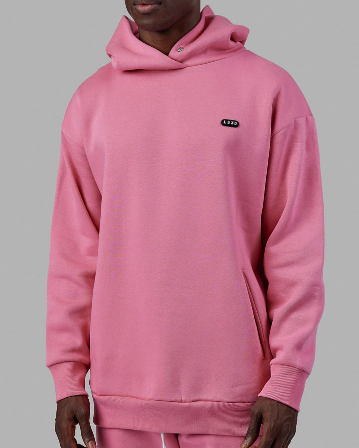 Man wearing Unisex Capsule Hoodie Oversize - Pink Rose