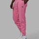 Man wearing Unisex Capsule Track Pants - Pink Rose