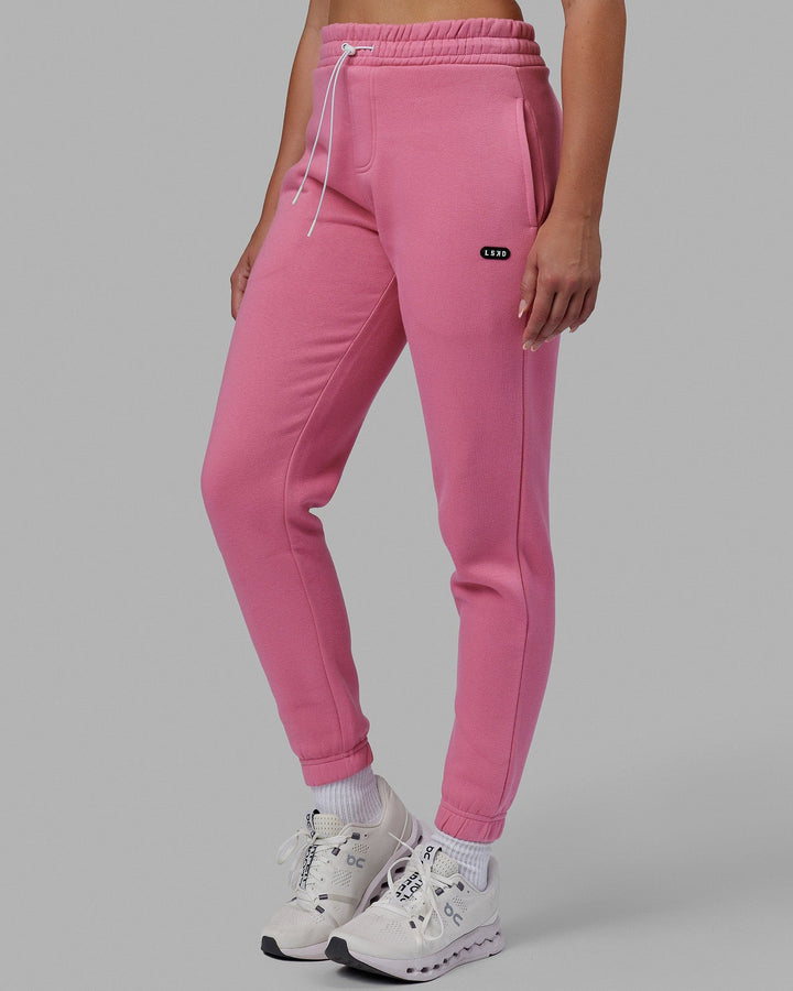 Woman wearing Unisex Capsule Track Pants - Pink Rose