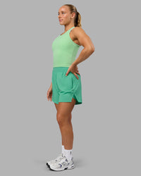 Woman wearing Challenger 5" Lined Performance Shorts - Mystic Green