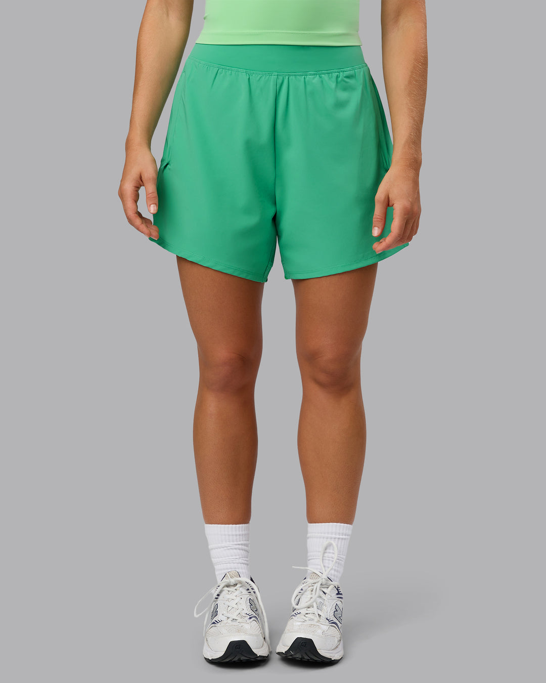 Woman wearing Challenger 5&quot; Lined Performance Shorts - Mystic Green