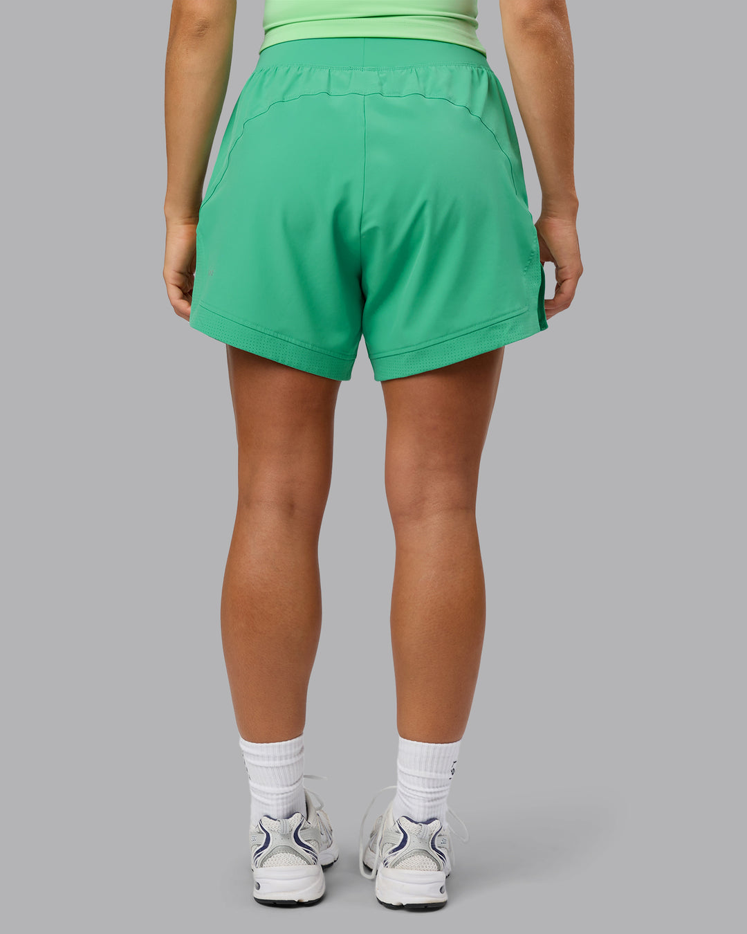 Woman wearing Challenger 5&quot; Lined Performance Shorts - Mystic Green