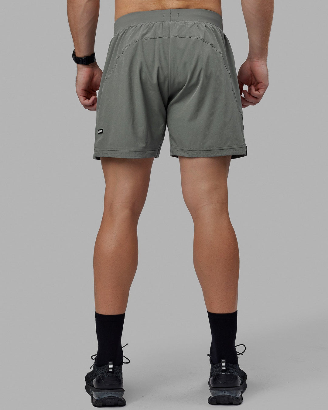 Man wearing Challenger 6&quot; Lined Performance Shorts - Graphite