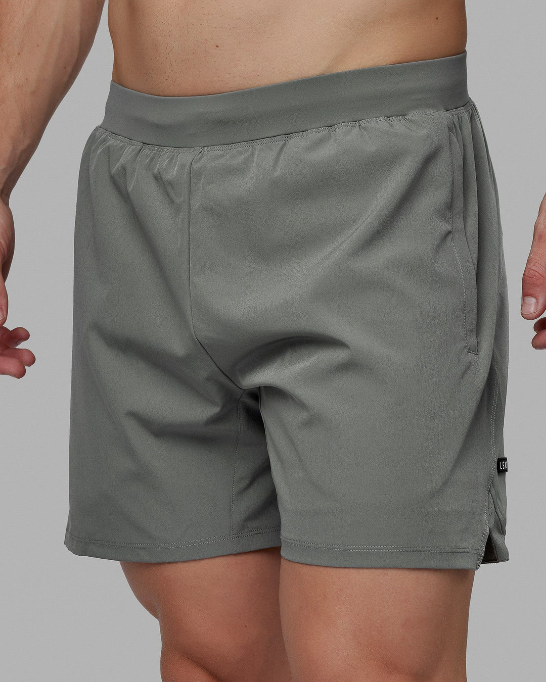 Man wearing Challenger 6&quot; Lined Performance Shorts - Graphite