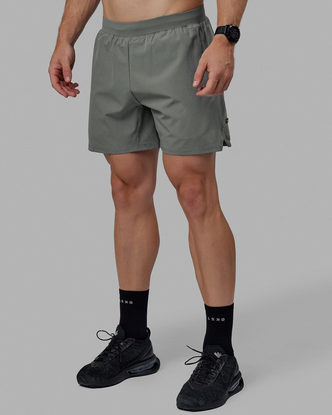 Man wearing Challenger 6&quot; Lined Performance Shorts - Graphite