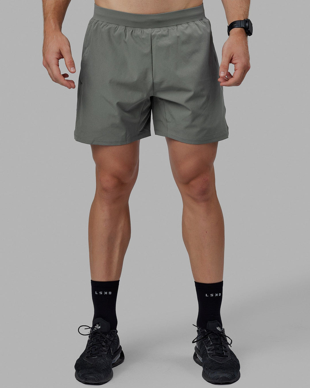 Man wearing Challenger 6&quot; Lined Performance Shorts - Graphite