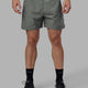 Man wearing Challenger 6" Lined Performance Shorts - Graphite