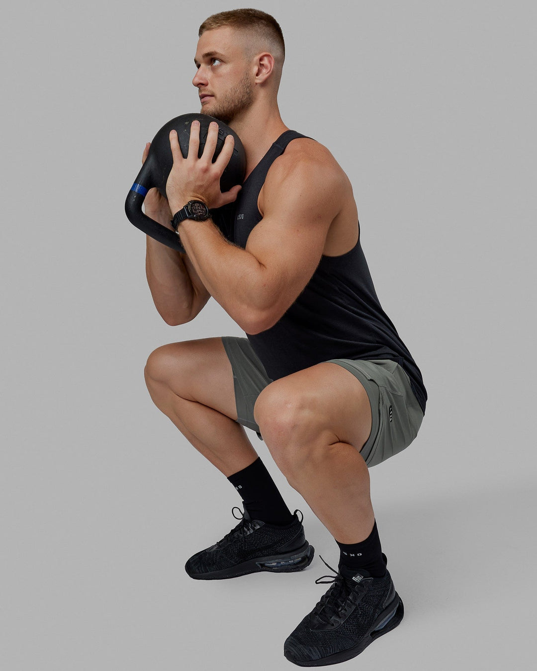 Man wearing Challenger 6&quot; Lined Performance Shorts - Graphite