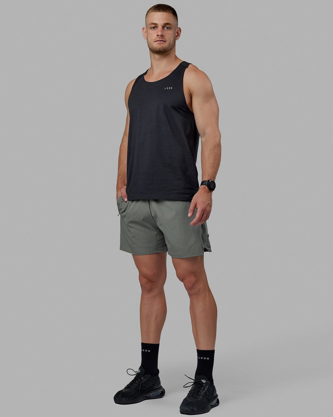 Man wearing Challenger 6&quot; Lined Performance Shorts - Graphite