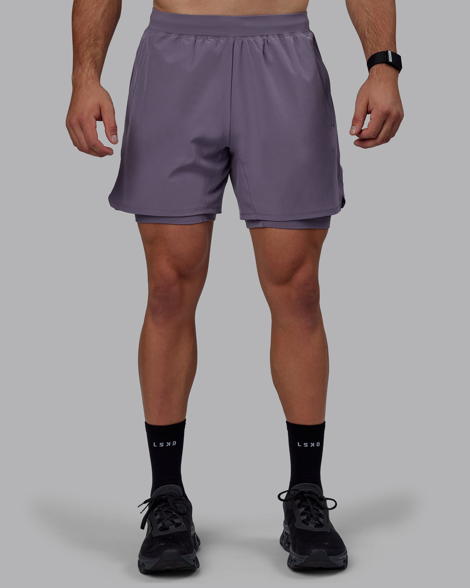Man wearing Challenger 6" Lined Performance Shorts - Purple Sage
