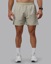 Man wearing Challenger 6" Lined Performance Shorts - Sustained Grey