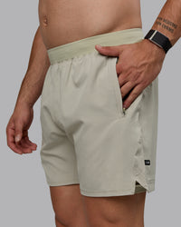 Man wearing Challenger 6" Lined Performance Shorts - Sustained Grey