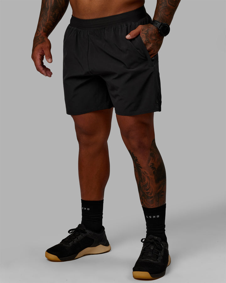 Man wearing Challenger 6" Lined Performance Shorts - Pirate Black