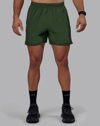 Man wearing Challenger 6" Performance Shorts - Cilantro