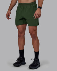 Man wearing Challenger 6" Performance Shorts - Cilantro