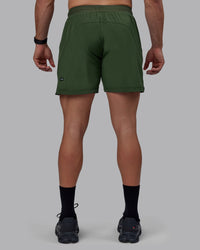 Man wearing Challenger 6" Performance Shorts - Cilantro
