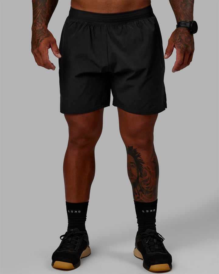 Man wearing Challenger 6" Performance Shorts - Pirate Black