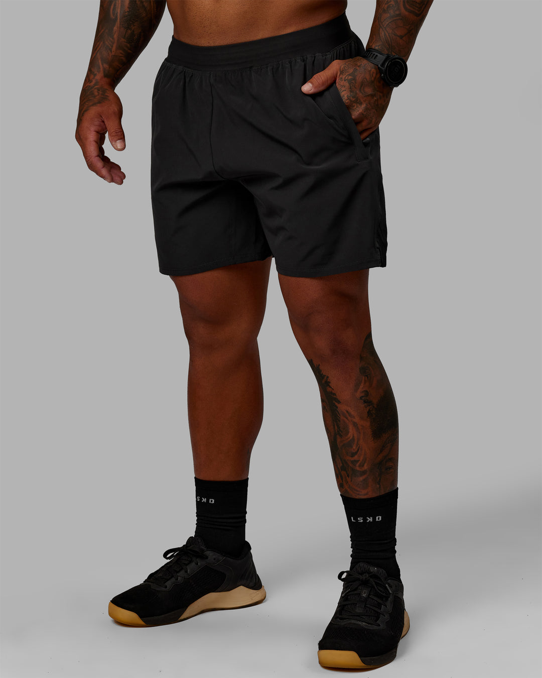 Man wearing Challenger 6" Performance Shorts - Pirate Black