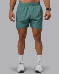 Man wearing Challenger 6" Performance Shorts - Sagebrush