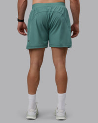 Man wearing Challenger 6" Performance Shorts - Sagebrush
