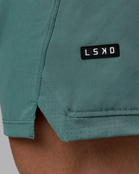 Man wearing Challenger 6" Performance Shorts - Sagebrush