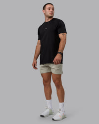 Man wearing Challenger 6" Performance Shorts - Sustained Grey
