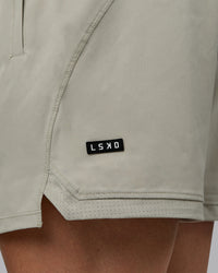 Man wearing Challenger 6" Performance Shorts - Sustained Grey