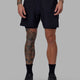 Man wearing Challenger 6" Lined Performance Short - Black